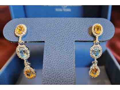 Stunning drop earrings with diamonds surrounding blue and yellow topaz, from Raineri Jewel