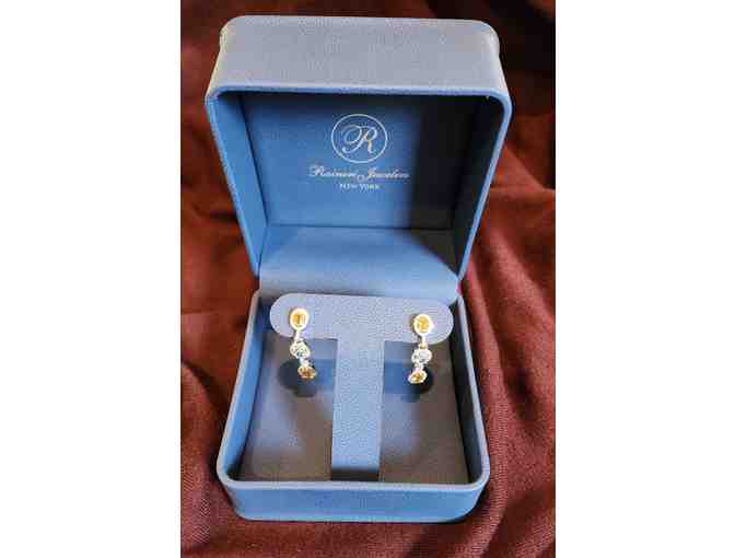 Stunning drop earrings with diamonds surrounding blue and yellow topaz, from Raineri Jewel